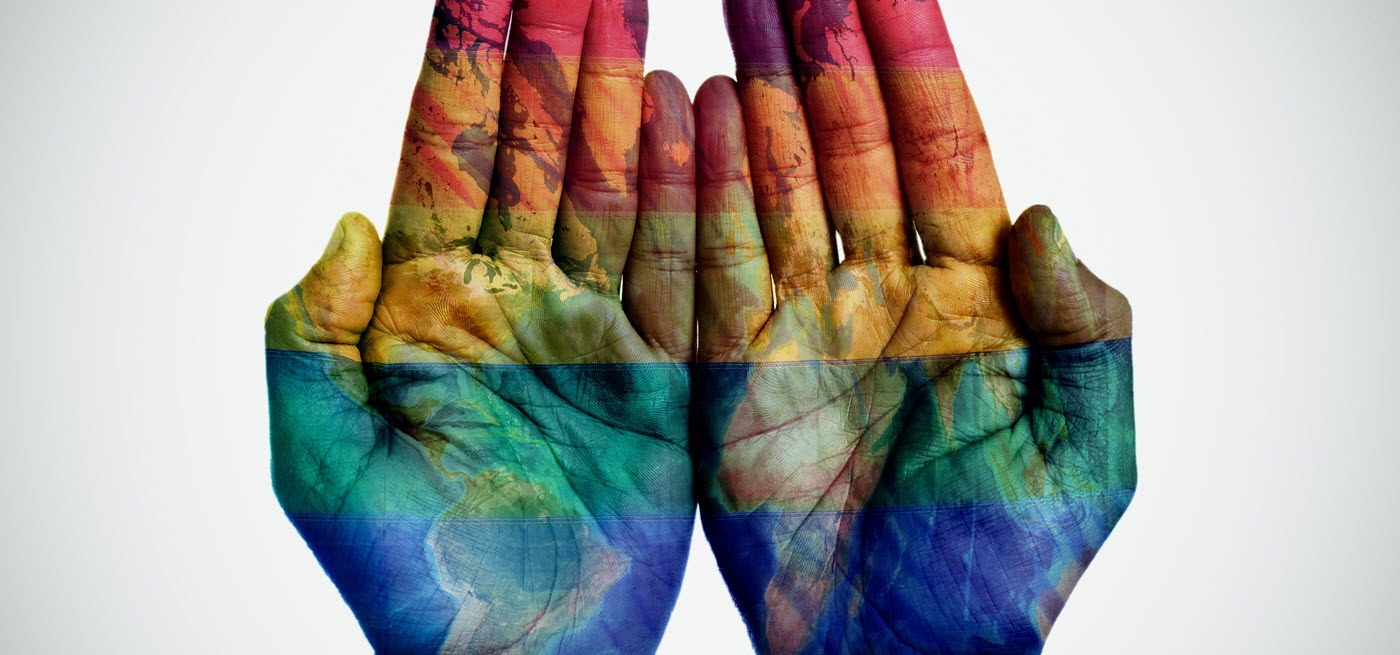 Hands with the Rainbow over them