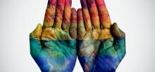 Hands with the Rainbow over them